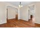 Dining area with hardwood floors, arched doorways, and access to the kitchen at 3995 Manorbrier Cir, Castle Rock, CO 80104