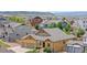 Aerial view of a single-Gathering home in a suburban neighborhood at 3995 Manorbrier Cir, Castle Rock, CO 80104