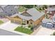 Overhead view of a lovely single-Gathering home with a well-kept lawn and a two-car garage at 3995 Manorbrier Cir, Castle Rock, CO 80104