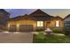 Charming two-story home with a well-maintained lawn and a two-car garage at 3995 Manorbrier Cir, Castle Rock, CO 80104