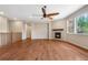 Cozy living room featuring a fireplace, hardwood floors, and natural light at 3995 Manorbrier Cir, Castle Rock, CO 80104