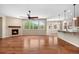Spacious living room boasts a fireplace, hardwood floors, and large windows with views to the outside at 3995 Manorbrier Cir, Castle Rock, CO 80104