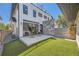 Charming backyard with patio, artificial grass and modern stone wall at 2525 S Pearl St, Denver, CO 80210