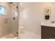 This bathroom has modern finishes, a frameless glass shower, and stylish hexagonal tile flooring at 2525 S Pearl St, Denver, CO 80210