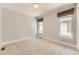 This inviting bedroom has neutral walls, carpet flooring, and two windows that provide ample natural light at 2525 S Pearl St, Denver, CO 80210