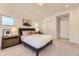 Bright bedroom with a comfortable king bed, bedside tables, two closets, and neutral carpet at 2525 S Pearl St, Denver, CO 80210