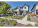Beautiful home exterior featuring lush landscaping and a well-maintained lawn at 2525 S Pearl St, Denver, CO 80210