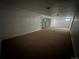 Large unfinished basement space with carpeted floor and access to multiple rooms at 3577 S Ouray Cir, Aurora, CO 80013