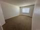Bedroom with plush carpeting, a window, and a neutral color palette at 3577 S Ouray Cir, Aurora, CO 80013