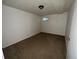 A simple carpeted bedroom has neutral colors and a window for natural light at 3577 S Ouray Cir, Aurora, CO 80013