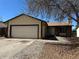 Charming single-story home featuring a two-car garage and rock landscaping at 3577 S Ouray Cir, Aurora, CO 80013