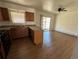 Kitchen featuring wooden cabinets, stone countertops, and stainless steel appliances at 3577 S Ouray Cir, Aurora, CO 80013