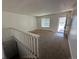 Bright living room featuring carpeted flooring and a door to the outside at 3577 S Ouray Cir, Aurora, CO 80013