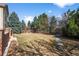 Large backyard featuring a grass lawn with mature trees at 21548 E Ottawa Cir, Aurora, CO 80016
