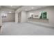 Unfurnished basement space with walk-up bar and windows for natural light at 21548 E Ottawa Cir, Aurora, CO 80016