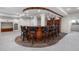 Spacious basement bar with seating for several and custom wood and tile accents at 21548 E Ottawa Cir, Aurora, CO 80016