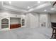 Finished basement with built-in shelves and drawers and access to a bathroom at 21548 E Ottawa Cir, Aurora, CO 80016