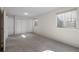Finished basement features three closets, a small window, and neutral carpet at 21548 E Ottawa Cir, Aurora, CO 80016