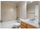 Full bathroom with a tub and shower combo, a vanity, and ample lighting at 21548 E Ottawa Cir, Aurora, CO 80016