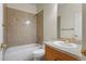Bathroom features tan tile walls, standard tub-shower combo, and vanity sink at 21548 E Ottawa Cir, Aurora, CO 80016