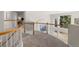 Bright upper-level hallway with windows and wood railing at 21548 E Ottawa Cir, Aurora, CO 80016