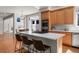 Bright kitchen featuring stainless steel appliances, island with cooktop, and plenty of cabinet space at 21548 E Ottawa Cir, Aurora, CO 80016