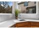 Bright kitchen featuring a sink with a large window at 21548 E Ottawa Cir, Aurora, CO 80016