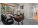 Bright home office with a large window, fireplace and modern desk at 21548 E Ottawa Cir, Aurora, CO 80016