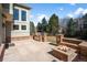 Outdoor patio features a built-in grill and a cozy brick firepit seating area at 21548 E Ottawa Cir, Aurora, CO 80016