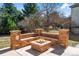 Beautiful brick built-in firepit seating area provides an intimate space for outdoor relaxation at 21548 E Ottawa Cir, Aurora, CO 80016
