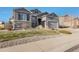 Two-story home with stone accents and landscaped yard at 3153 Eagle Claw Pl, Castle Rock, CO 80108