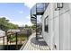 Modern balcony with metal spiral staircase and views of the neighborhood at 3926 Kalamath St, Denver, CO 80211