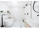 Bright, modern bathroom with freestanding tub, glass shower, and modern fixtures at 3926 Kalamath St, Denver, CO 80211