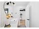 Modern bathroom with decorative wallpaper, sleek vanity, and unique lighting at 3926 Kalamath St, Denver, CO 80211