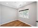 Bright, modern bedroom with hardwood floors and a large window for ample natural light at 3926 Kalamath St, Denver, CO 80211