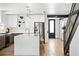 Bright and airy kitchen featuring an island, pendant lights, and stainless steel appliances at 3926 Kalamath St, Denver, CO 80211