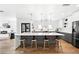 Contemporary kitchen featuring a large island with seating and modern appliances at 3926 Kalamath St, Denver, CO 80211
