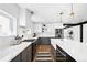 Well-appointed kitchen with quartz countertops, a farmhouse sink, and stainless steel appliances at 3926 Kalamath St, Denver, CO 80211