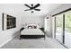 Spacious main bedroom featuring soft carpet, large bed and access to outside balcony at 3926 Kalamath St, Denver, CO 80211