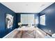 Stylish office featuring a colorful rug, ample sunlight, and dark blue walls at 3926 Kalamath St, Denver, CO 80211