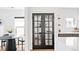 Elegant black French door leading to a well-organized pantry with natural light at 3926 Kalamath St, Denver, CO 80211