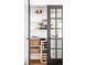 Walk-in pantry with custom shelving, stylish storage baskets, and a wine cooler at 3926 Kalamath St, Denver, CO 80211