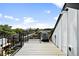 Rooftop deck offers open views of the city skyline and a modern railing at 3926 Kalamath St, Denver, CO 80211