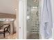 An unique glass block shower is a beautiful element to the bathroom, with an adjacent stairway at 726 S Corona St, Denver, CO 80209