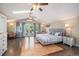 Spacious main bedroom with hardwood floors, vaulted ceilings, and a private balcony at 726 S Corona St, Denver, CO 80209