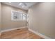 Light-filled bedroom with wood floors, white trim, and neutral walls, providing a calm and inviting space at 726 S Corona St, Denver, CO 80209