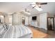Spacious main bedroom with hardwood floors, vaulted ceilings, and an en-suite bathroom at 726 S Corona St, Denver, CO 80209