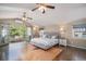 Spacious main bedroom with hardwood floors, vaulted ceilings, and a private balcony at 726 S Corona St, Denver, CO 80209