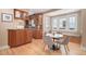 Cozy dining area featuring custom wood cabinetry, a built-in bench, and views of the neighborhood at 726 S Corona St, Denver, CO 80209