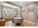 Bright dining area with a round table, stylish chairs, and a built-in window seat at 726 S Corona St, Denver, CO 80209
